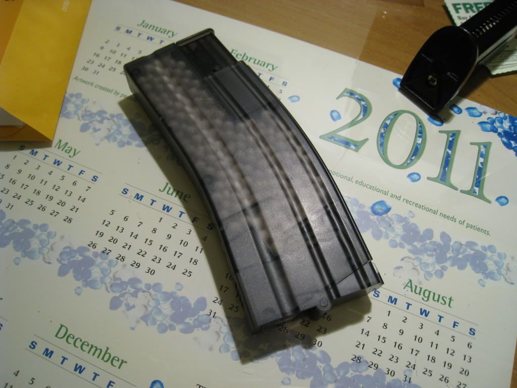 http://i8.photobucket.com/albums/a1/aznriptide859/Airsoft/KWA Magazine Speed Loader/IMG_1400.jpg